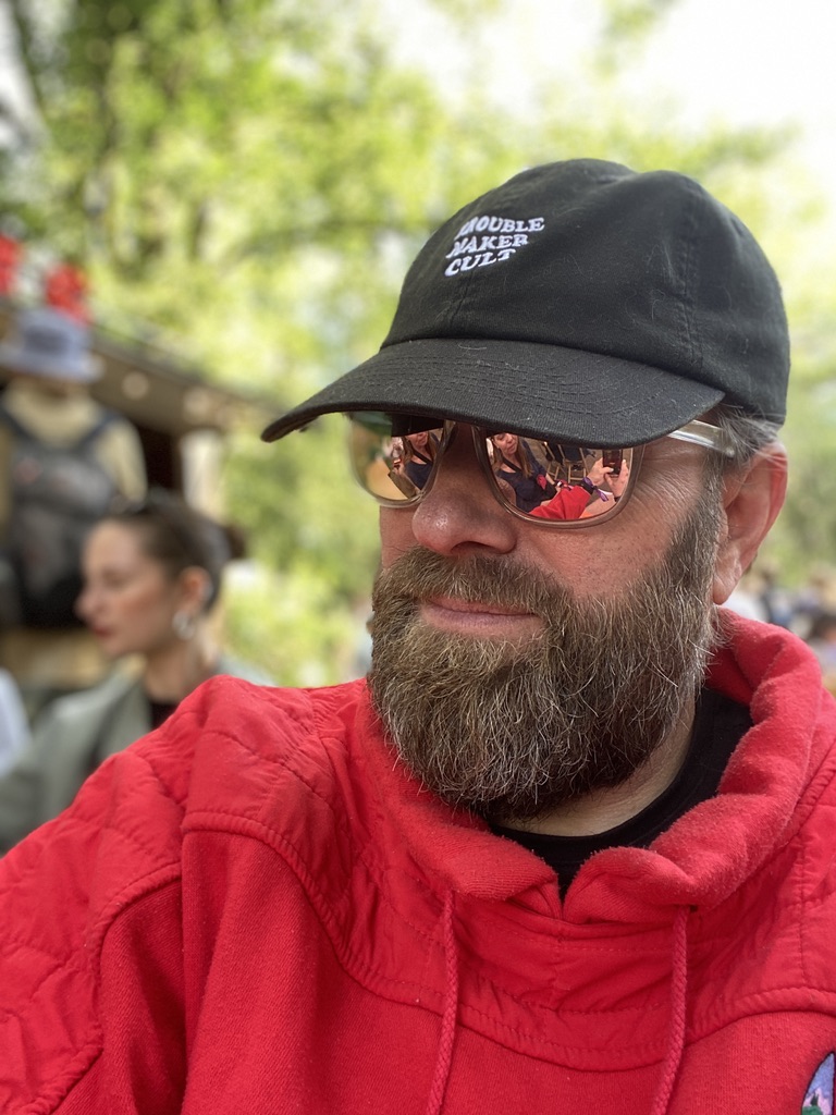 Perry wearing a Trouble Maker Cult cap