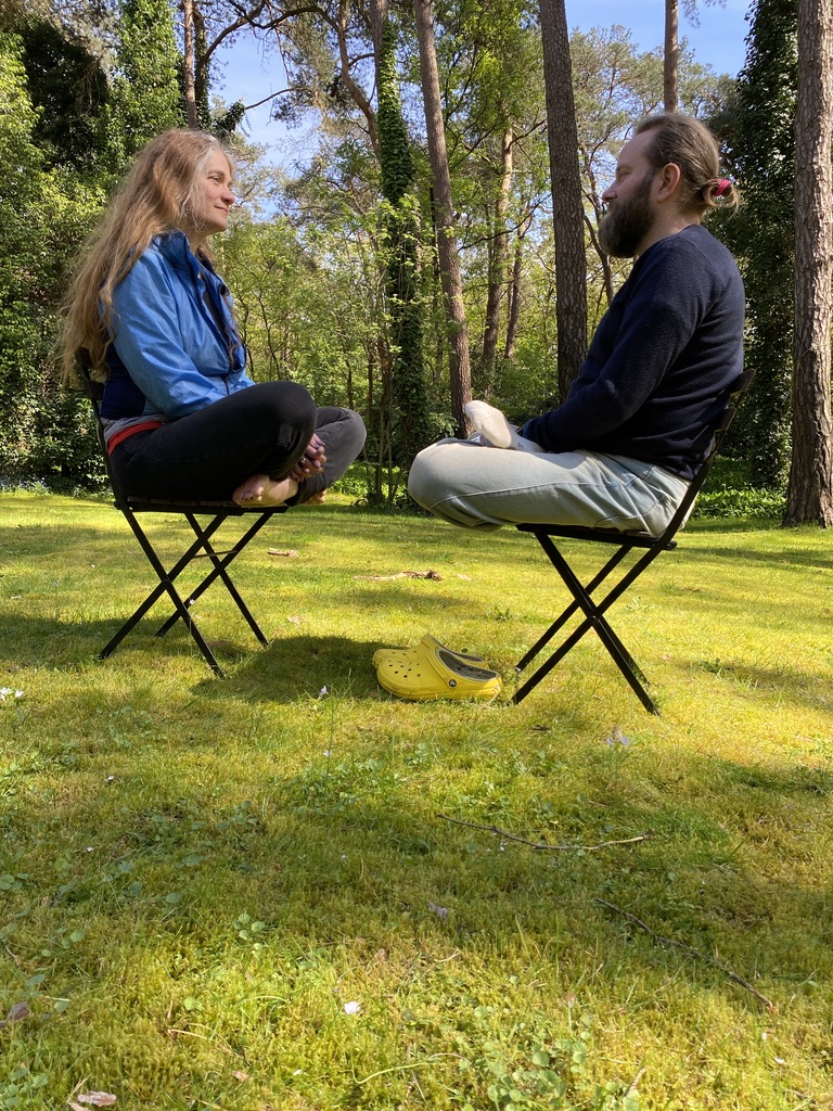 Perry meditating with a friend